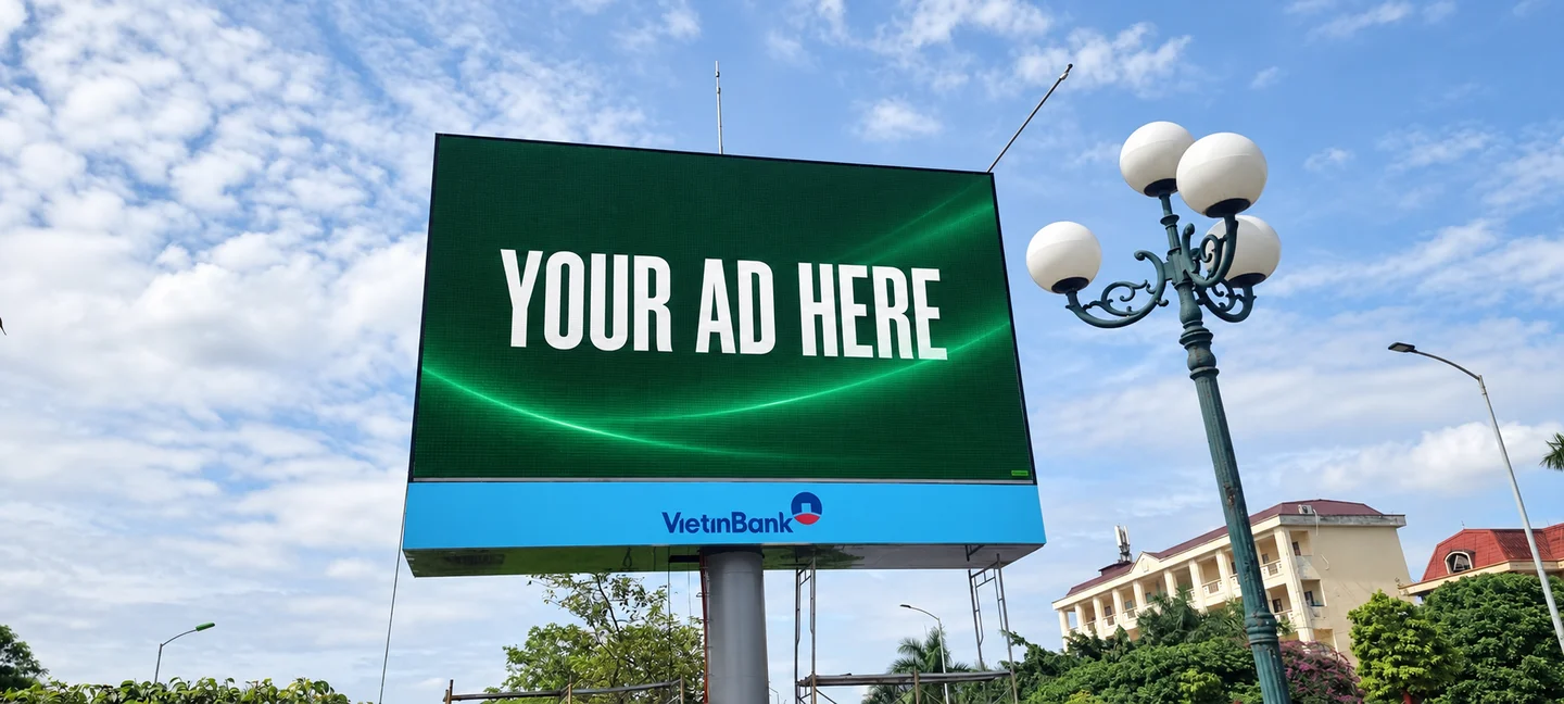 Large digital out-of-home billboard at a junction in Hải Dương