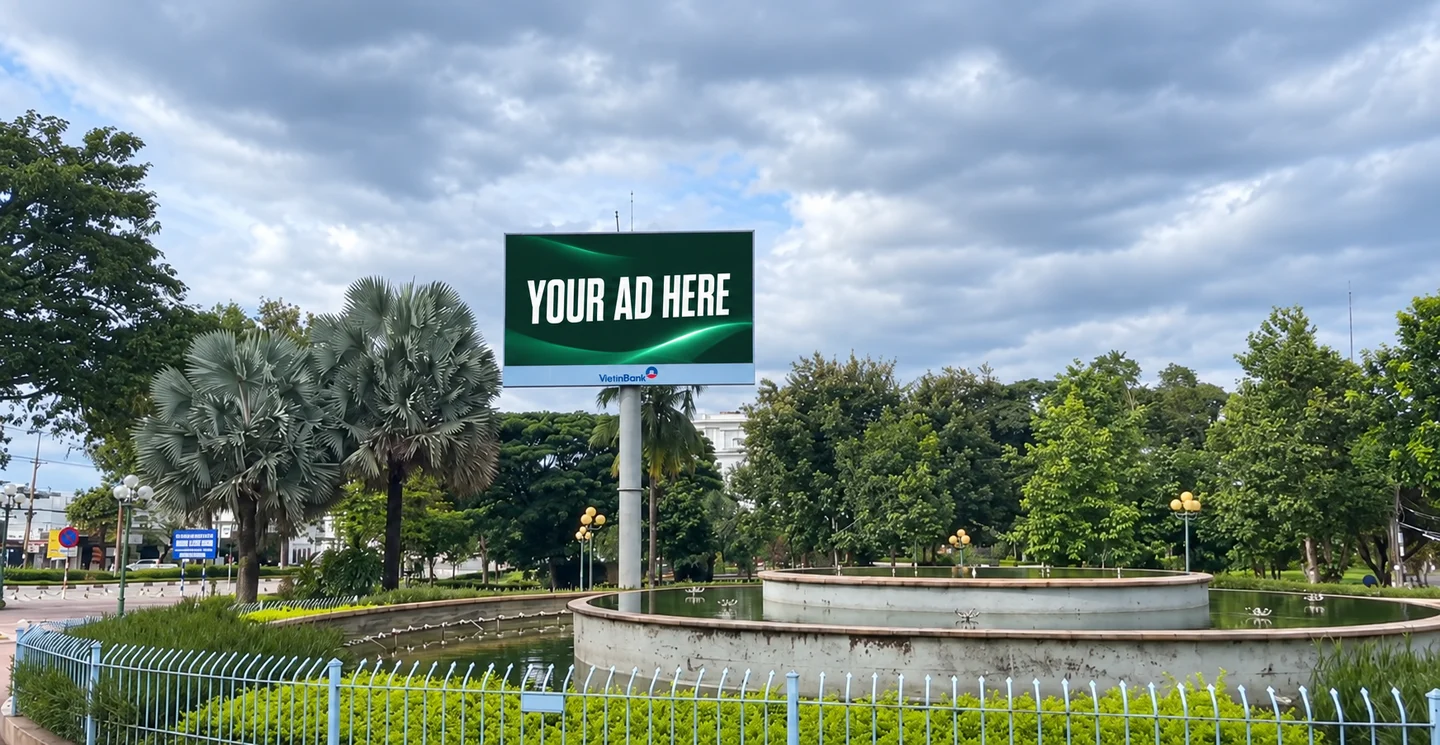 Digital out-of-home billboard beside a public square in Kon Tum