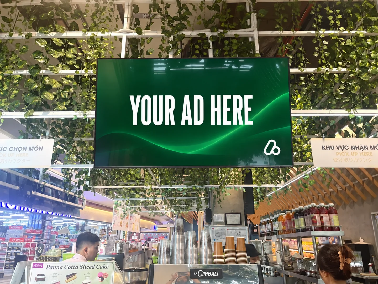 Digital advertising display above an AEON deli counter