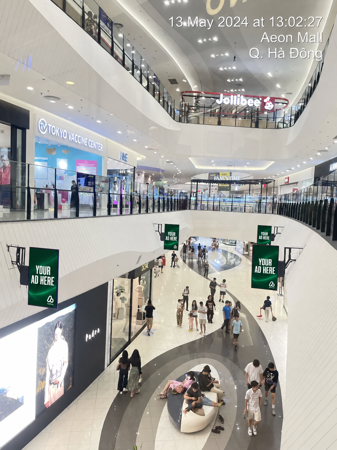 AdTRUE Global digital displays above shoppers at AEON Mall Hà Đông